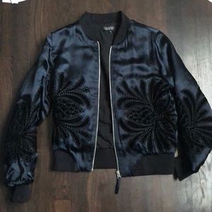 Black bomber jacket with floral pattern